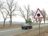 What the red triangle with a black dot road sign means in romania