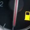 How far can you drive with the low fuel warning light and its risks