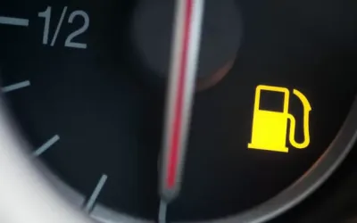 How far can you drive with the low fuel warning light and its risks
