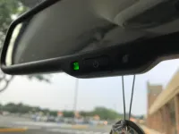 A cosa serve il pulsante sullo specchietto retrovisore?